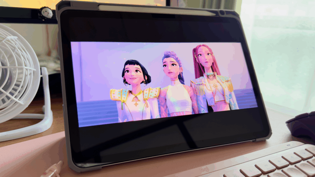 iPad on a desk with a scene from KPop Demon Hunters