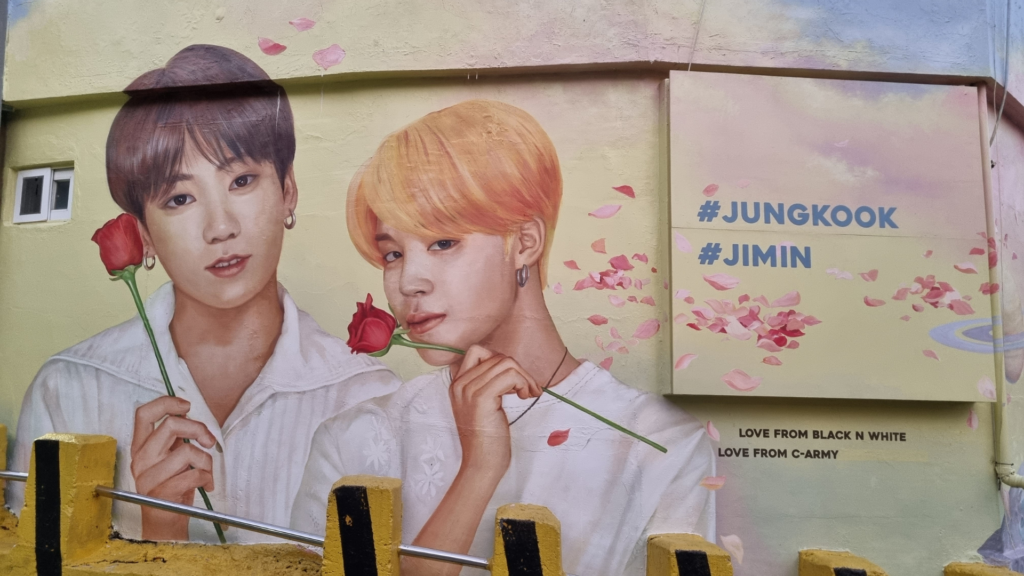 K-pop idols on a wall